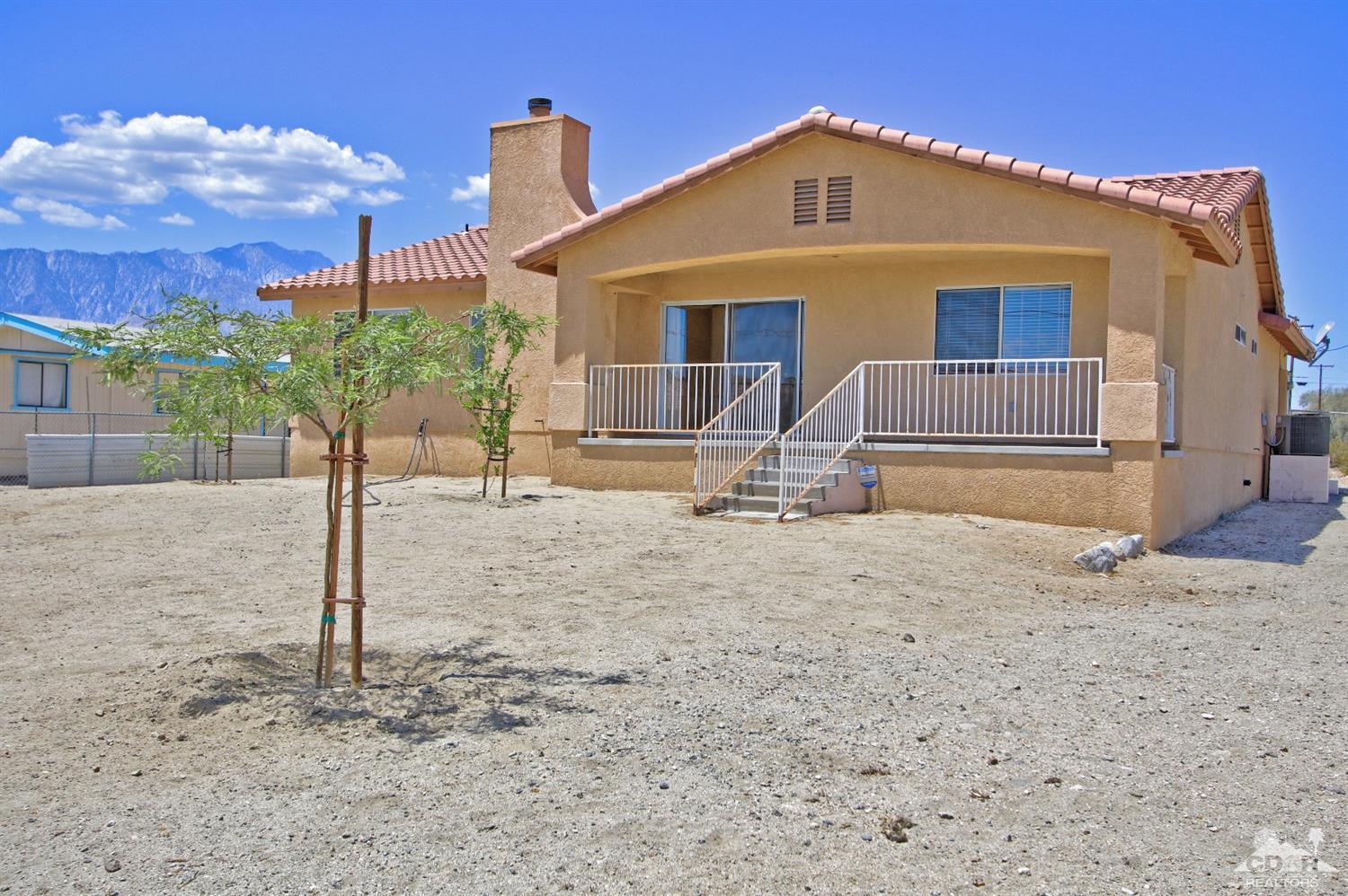 13810 United Road Desert Hot Springs, CA 92240 - Photo 33 of 41 a front view of a house with garden