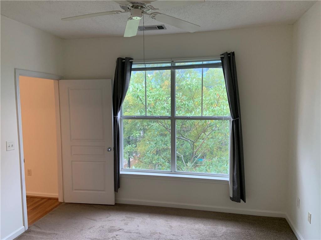 10 Perimeter Summit Boulevard, Unit 1404 Brookhaven, GA 30319 - Photo 13 of 39 a view of an empty room with a window