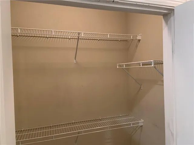 a view of a room with racks on the wall