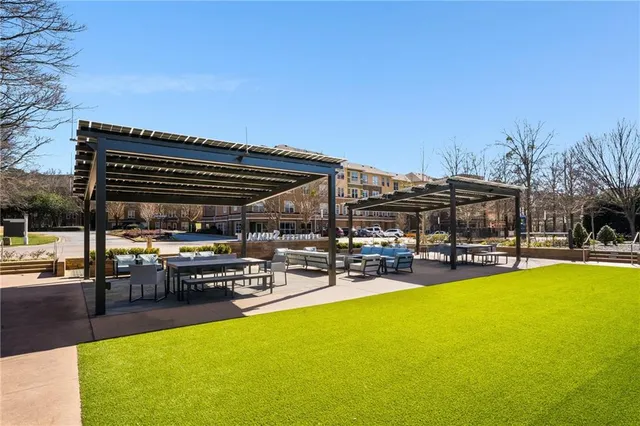 a view of a swimming pool with sitting area