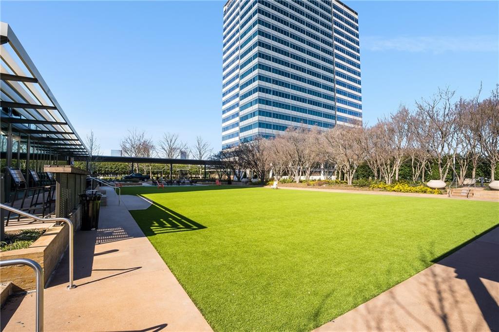 10 Perimeter Summit Boulevard, Unit 1404 Brookhaven, GA 30319 - Photo 25 of 39 a view of a swimming pool with an outdoor seating and a garden