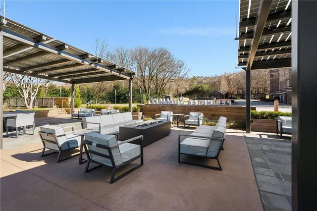 a outdoor living space with patio furniture and a fire pit