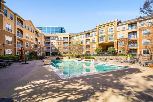 a view of pool with outdoor seating