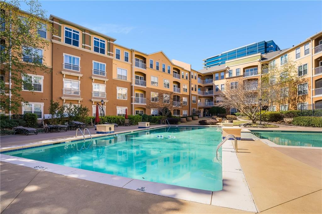 10 Perimeter Summit Boulevard, Unit 1404 Brookhaven, GA 30319 - Photo 28 of 39 a front view of building with yard