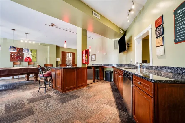 a large kitchen with stainless steel appliances lots of counter top space