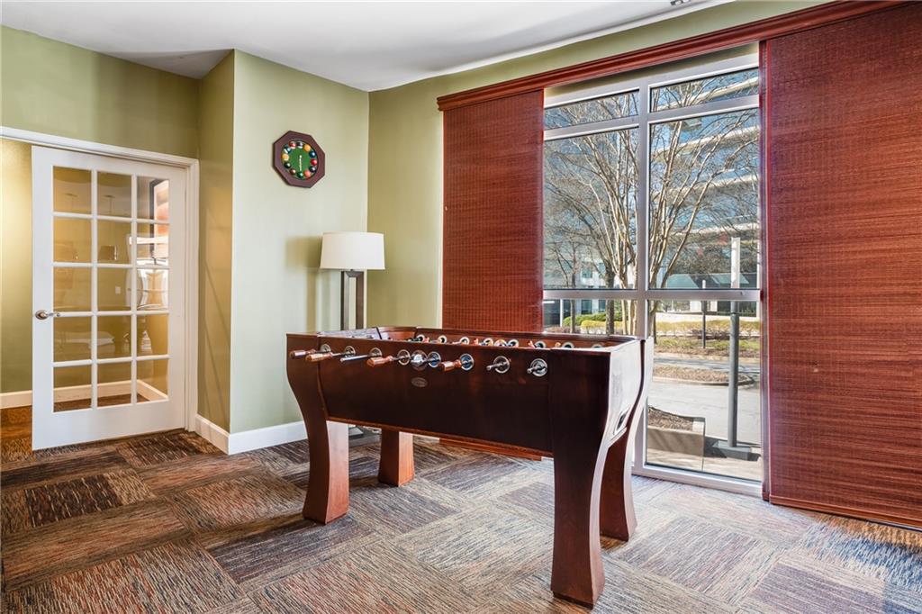 10 Perimeter Summit Boulevard, Unit 1404 Brookhaven, GA 30319 - Photo 32 of 39 a view of a living room and a wooden floor
