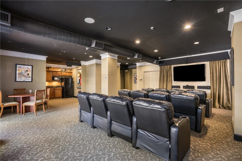 10 Perimeter Summit Boulevard, Unit 1404 Brookhaven, GA 30319 - Photo 33 of 39 a living room with furniture and a flat screen tv
