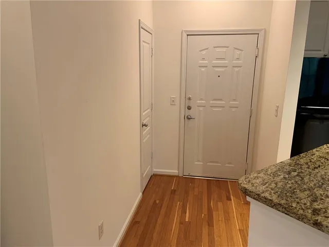 a view of hallway with wooden floor