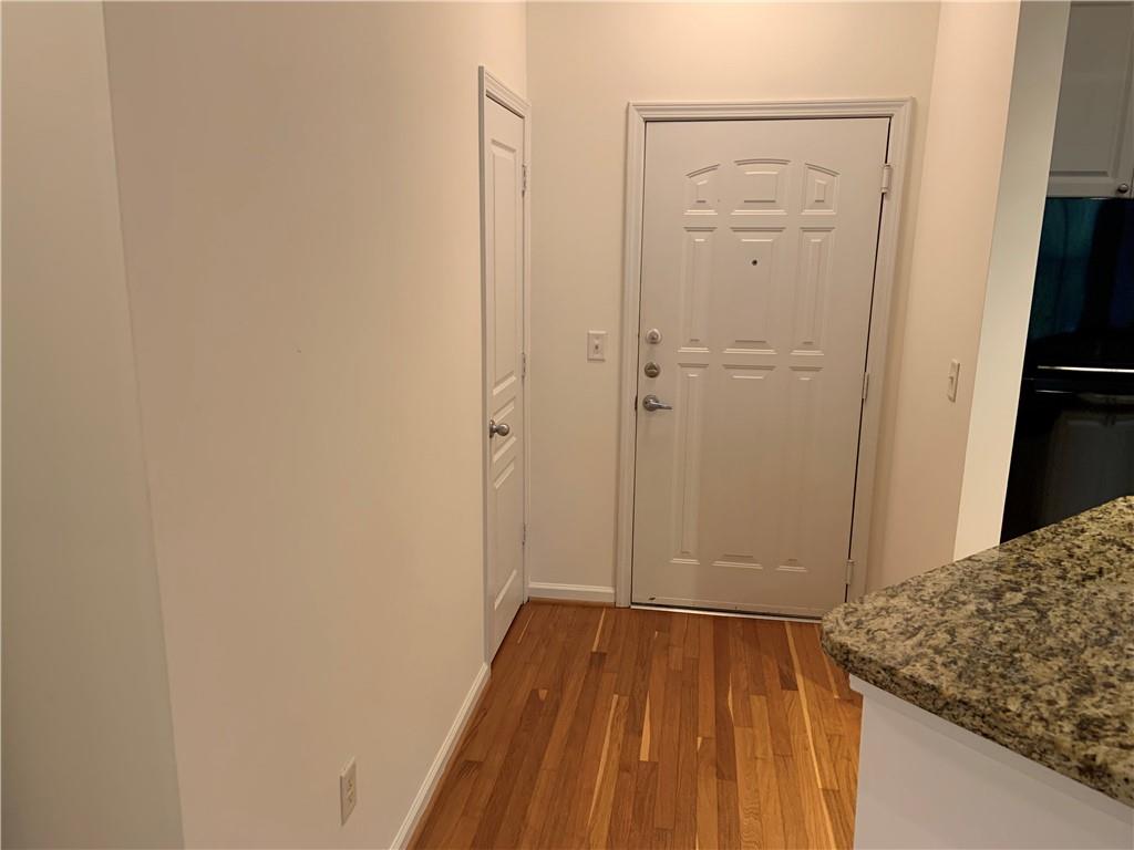 10 Perimeter Summit Boulevard, Unit 1404 Brookhaven, GA 30319 - Photo 6 of 39 a view of hallway with wooden floor