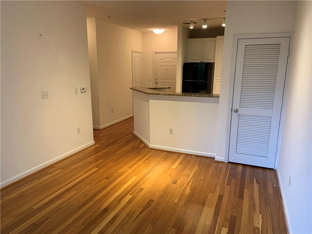 10 Perimeter Summit Boulevard, Unit 1404 Brookhaven, GA 30319 - Photo 7 of 39 a view of a kitchen from the hallway