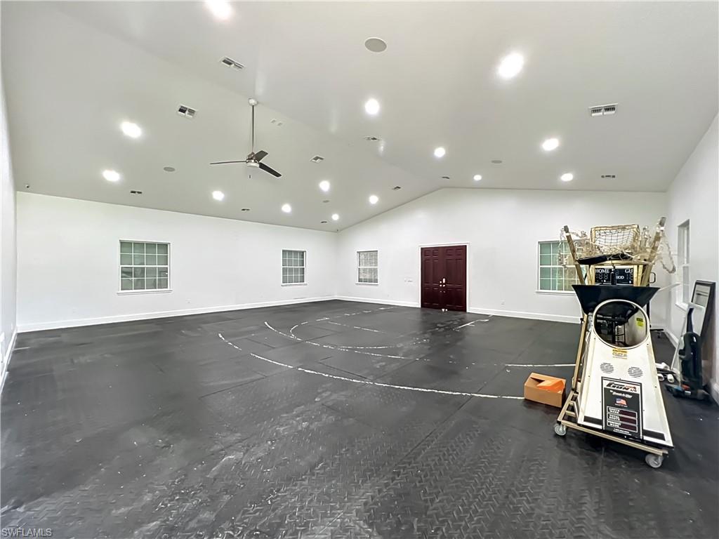 4210 South Hiawassee Road Orlando, FL 32835 - Photo 37 of 49 a room with gym equipment and windows