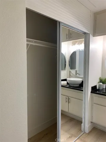 a bathroom with a double vanity sink and mirror