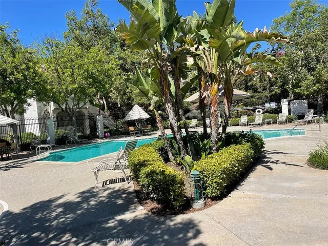 a view of a swimming pool with sitting area