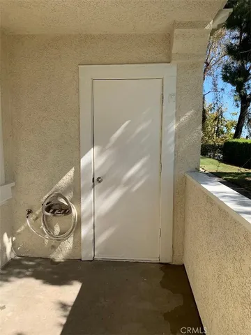 a view of storage and utility room with racks on the wall