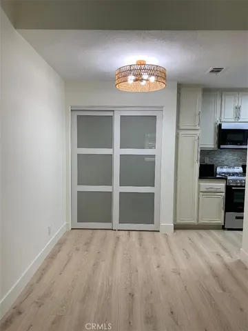 a kitchen with granite countertop a stove and a refrigerator