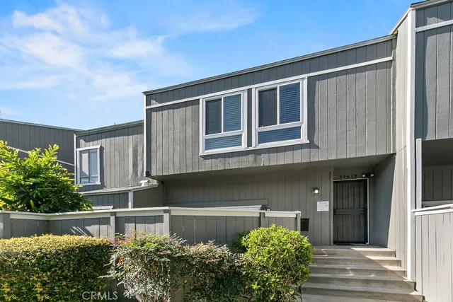 a front view of a house with a garage