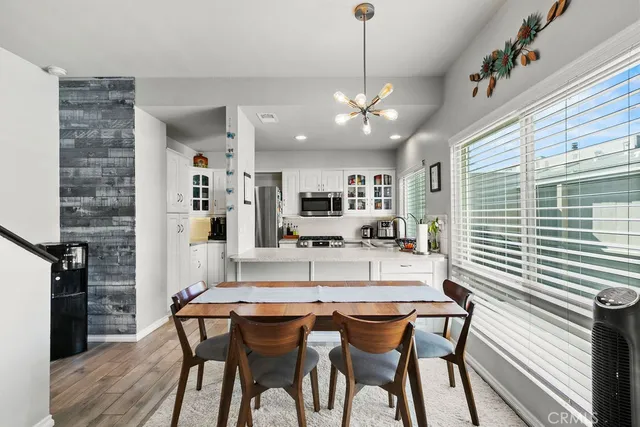 a dining room with furniture and window