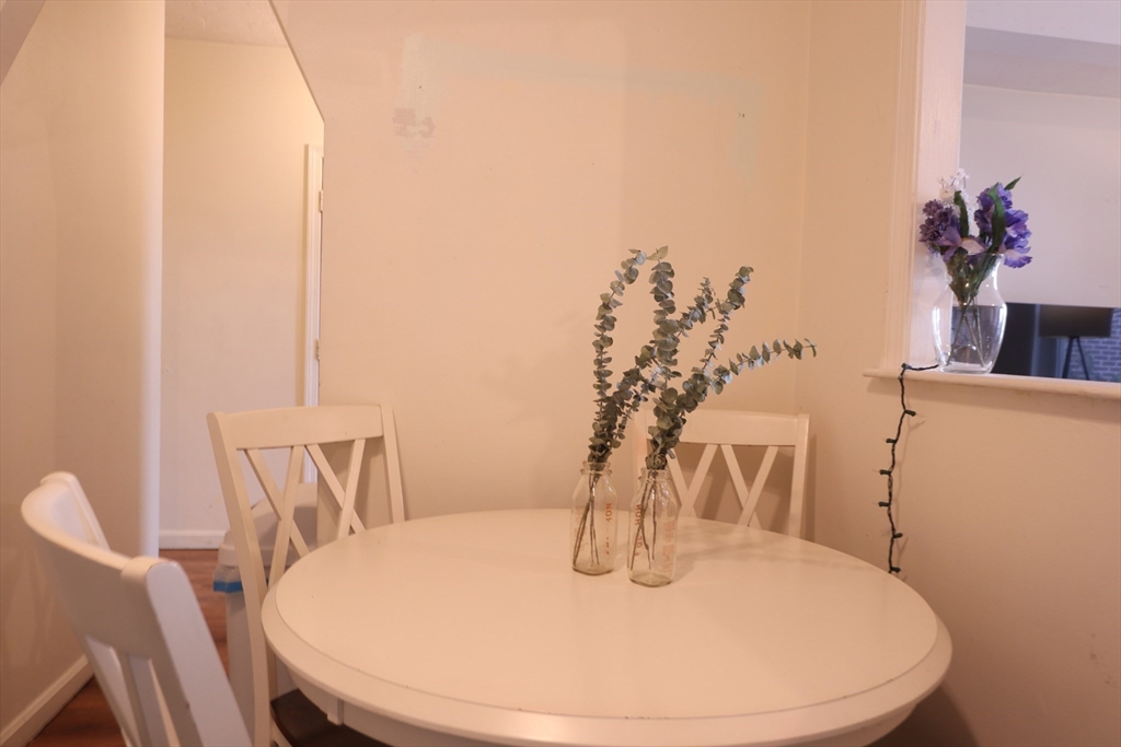 7 Saybrook Street, Unit 17 Boston, MA 02135 - Photo 13 of 30 a view of a dining room with furniture and wooden floor