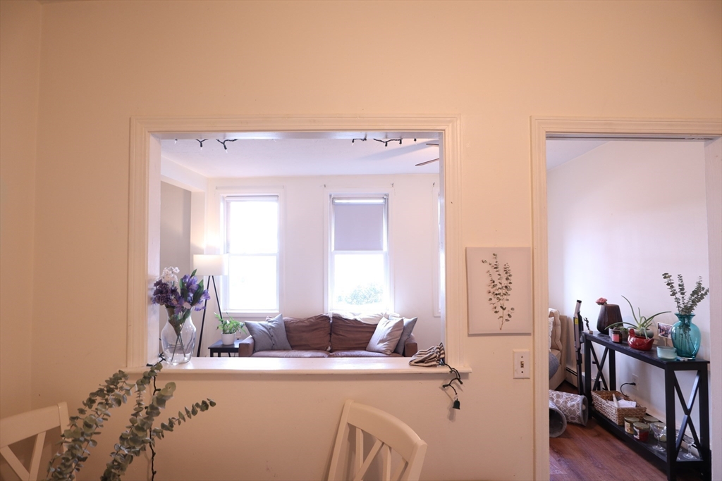 7 Saybrook Street, Unit 17 Boston, MA 02135 - Photo 14 of 30 a room with a table chairs and bedroom view