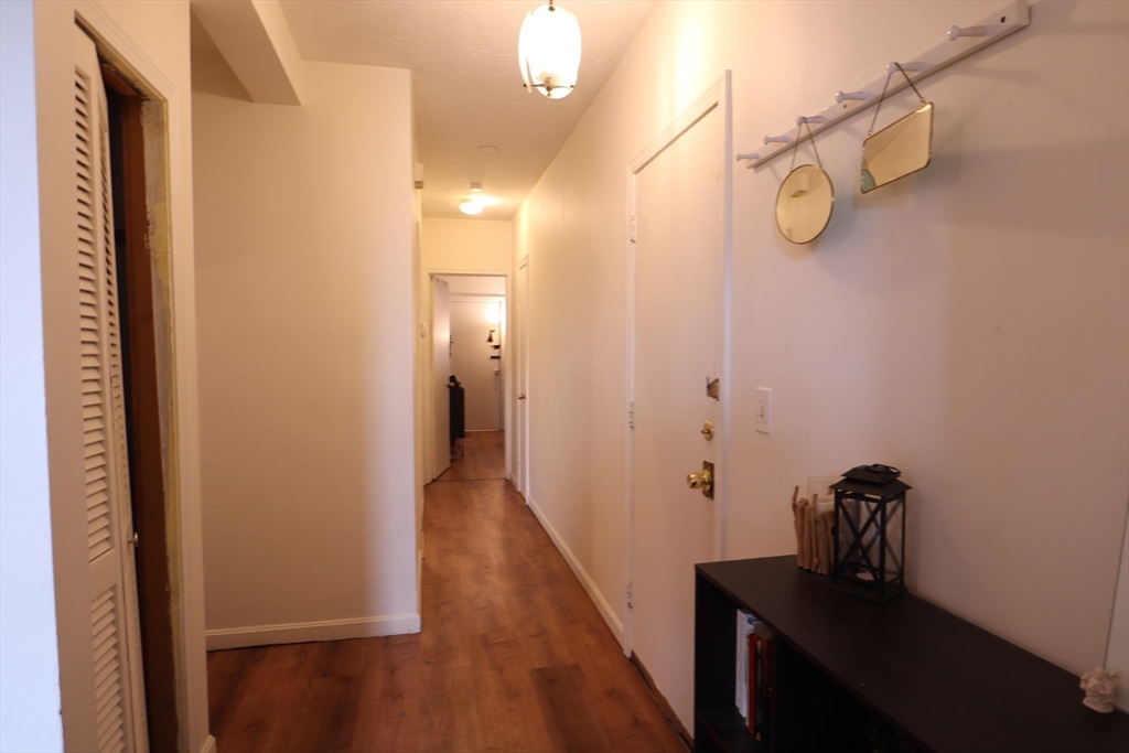 7 Saybrook Street, Unit 17 Boston, MA 02135 - Photo 16 of 30 a view of a bathroom from a hallway