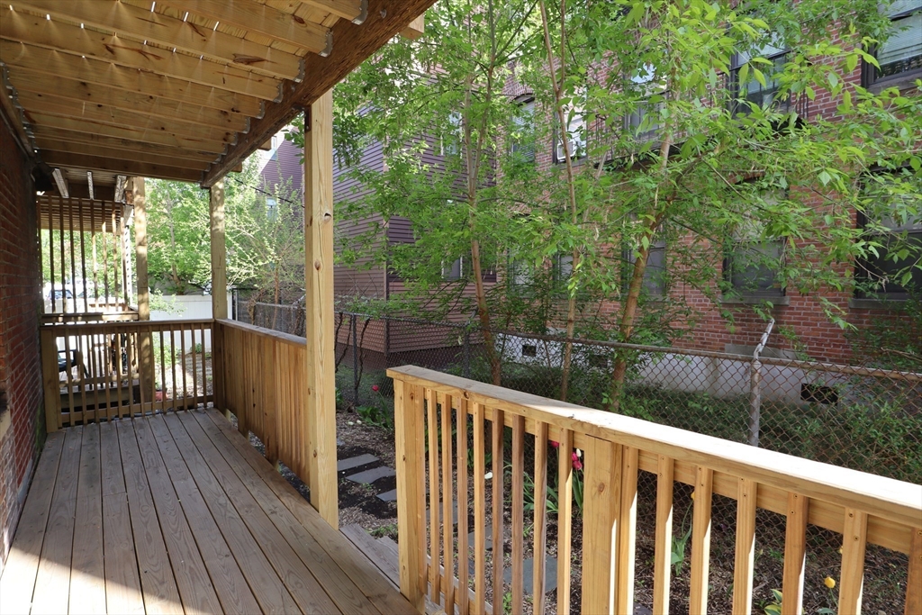 7 Saybrook Street, Unit 17 Boston, MA 02135 - Photo 21 of 30 a view of a balcony with wooden floor