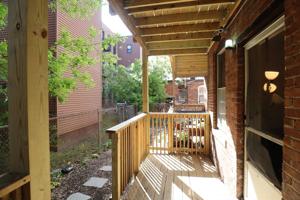 7 Saybrook Street, Unit 17 Boston, MA 02135 - Photo 22 of 30 a view of balcony with wooden floor