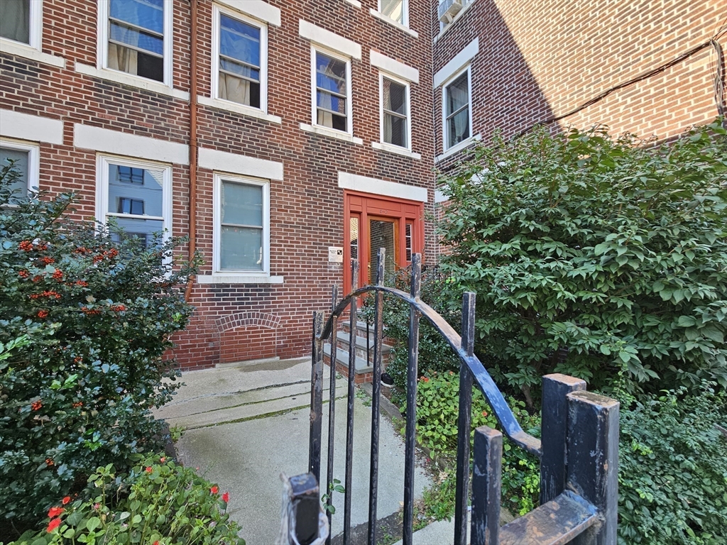 7 Saybrook Street, Unit 17 Boston, MA 02135 - Photo 27 of 30 a front view of a house with a tree