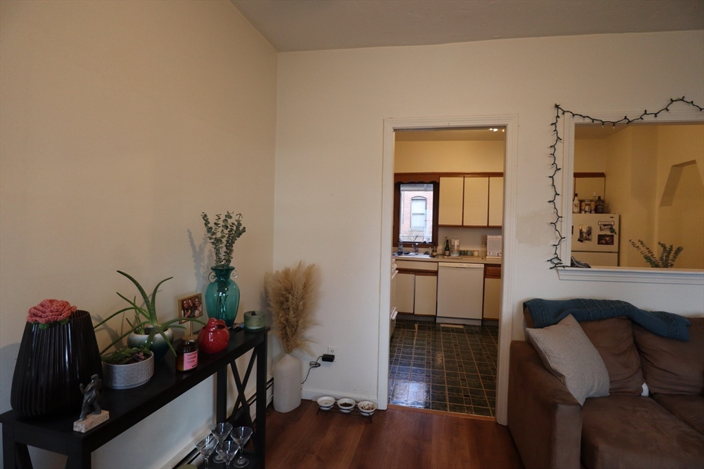 7 Saybrook Street, Unit 17 Boston, MA 02135 - Photo 4 of 30 a living room with furniture and wooden floor