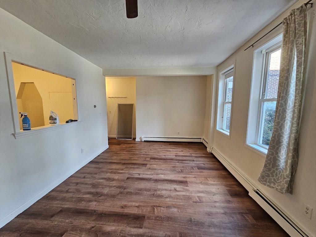 7 Saybrook Street, Unit 17 Boston, MA 02135 - Photo 5 of 30 a view of an empty room and glass door