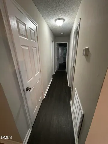 a view of a hallway with windows