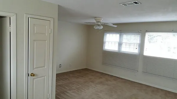 a view of an empty room with a window
