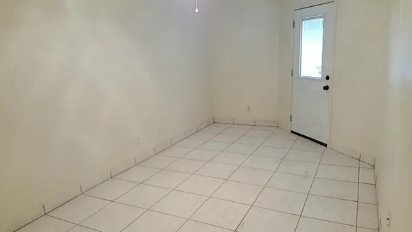 an empty room with white door