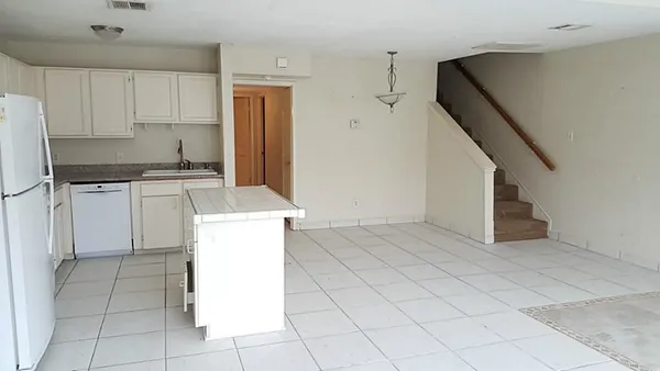 a kitchen with a cabinets and a stove top oven