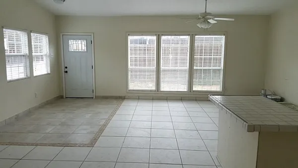 a view of an empty room with a window
