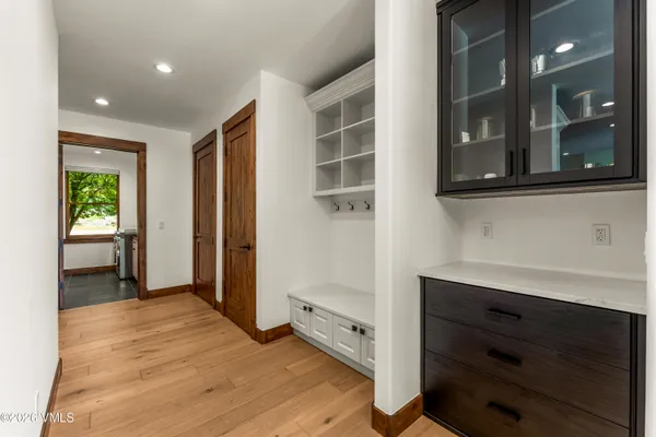 a living room with furniture ceiling fan and wooden floor