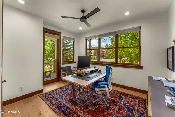 a view of a chairs and table in the balcony