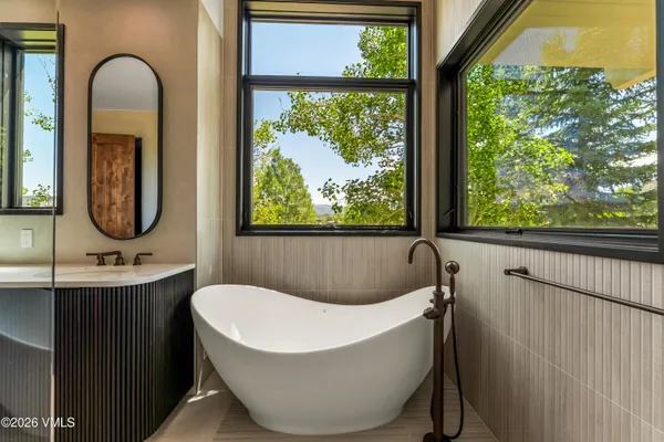 a bedroom with a bed closet and a window