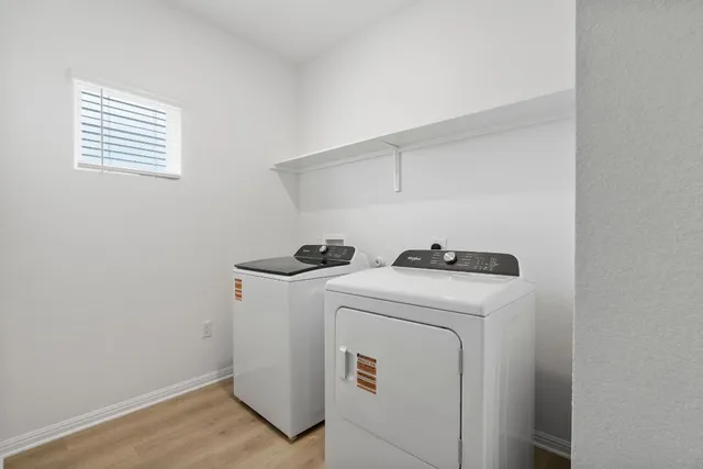 a bathroom with a granite countertop sink a mirror and a shower