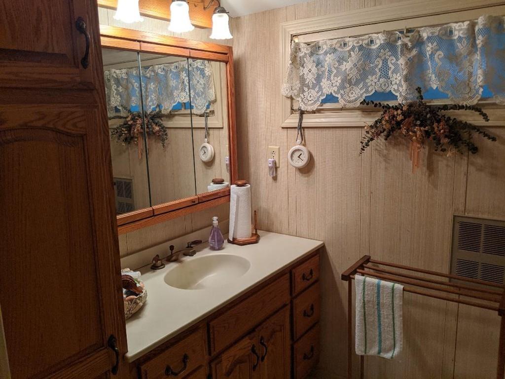 28 Farmhouse Road Chesterfield, MA 01012 - Photo 8 of 14 a bathroom with a sink vanity and a mirror
