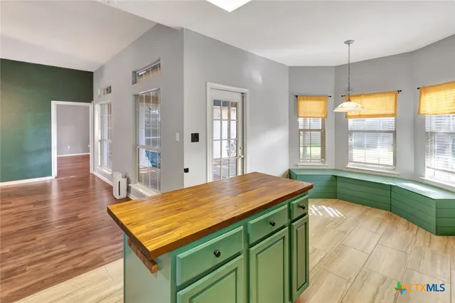 a kitchen with a sink and a wooden cabinets