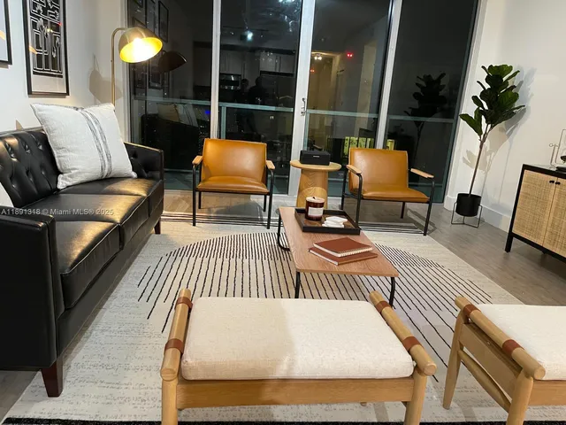 a balcony with couch and wooden floor