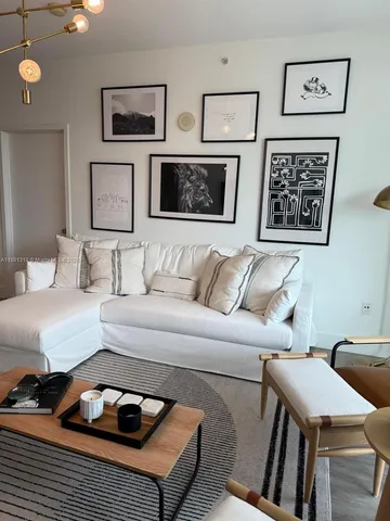 a bedroom with furniture and wooden floor