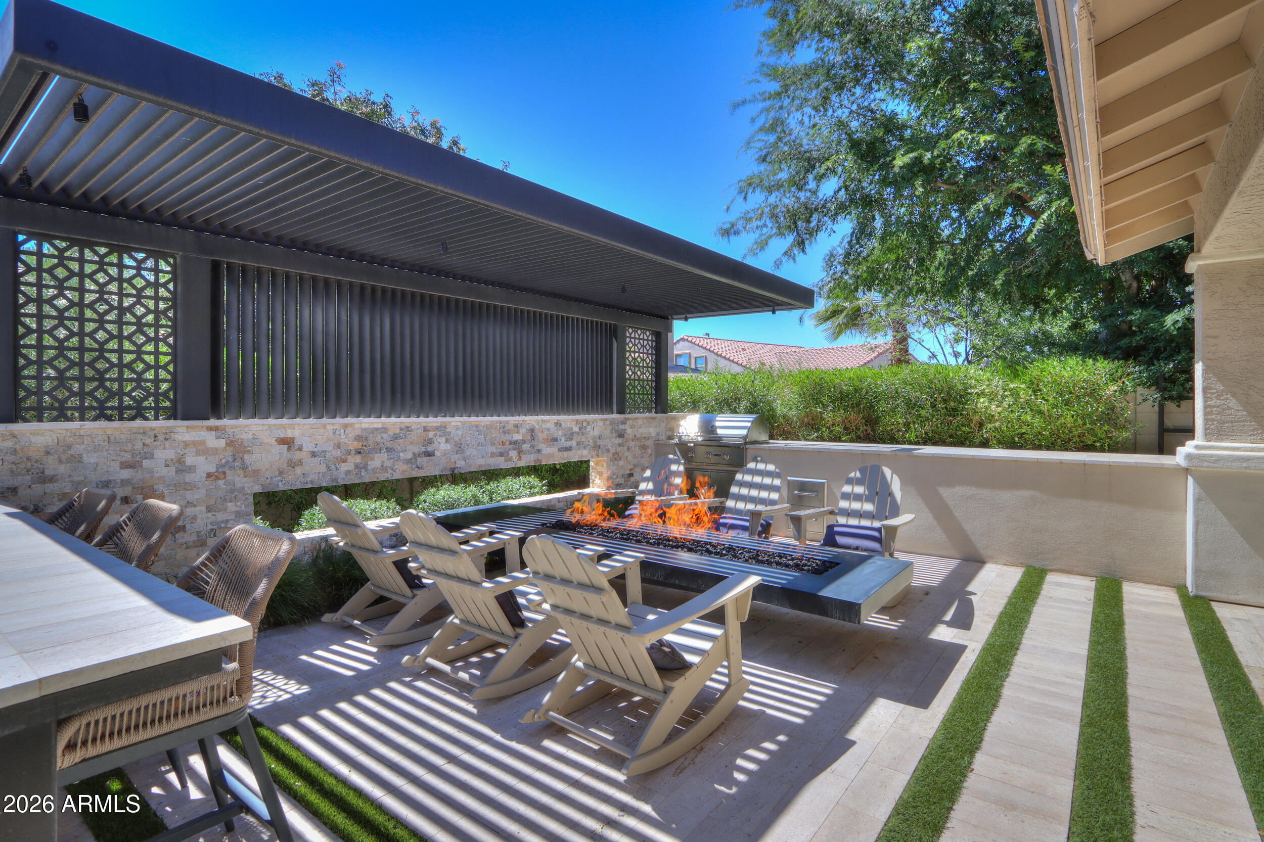 4575 East Waterman Street Gilbert, AZ 85297 - Photo 35 of 48 Fire table with pergola