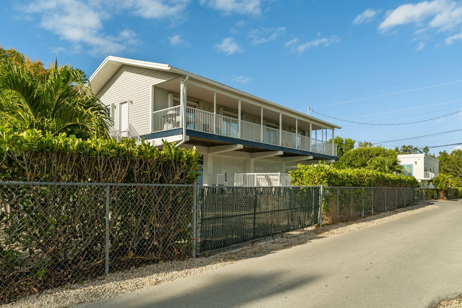 1010 Snapper Lane Key Largo, FL 33037 - Photo 21 of 26 a view of a house with a outdoor space