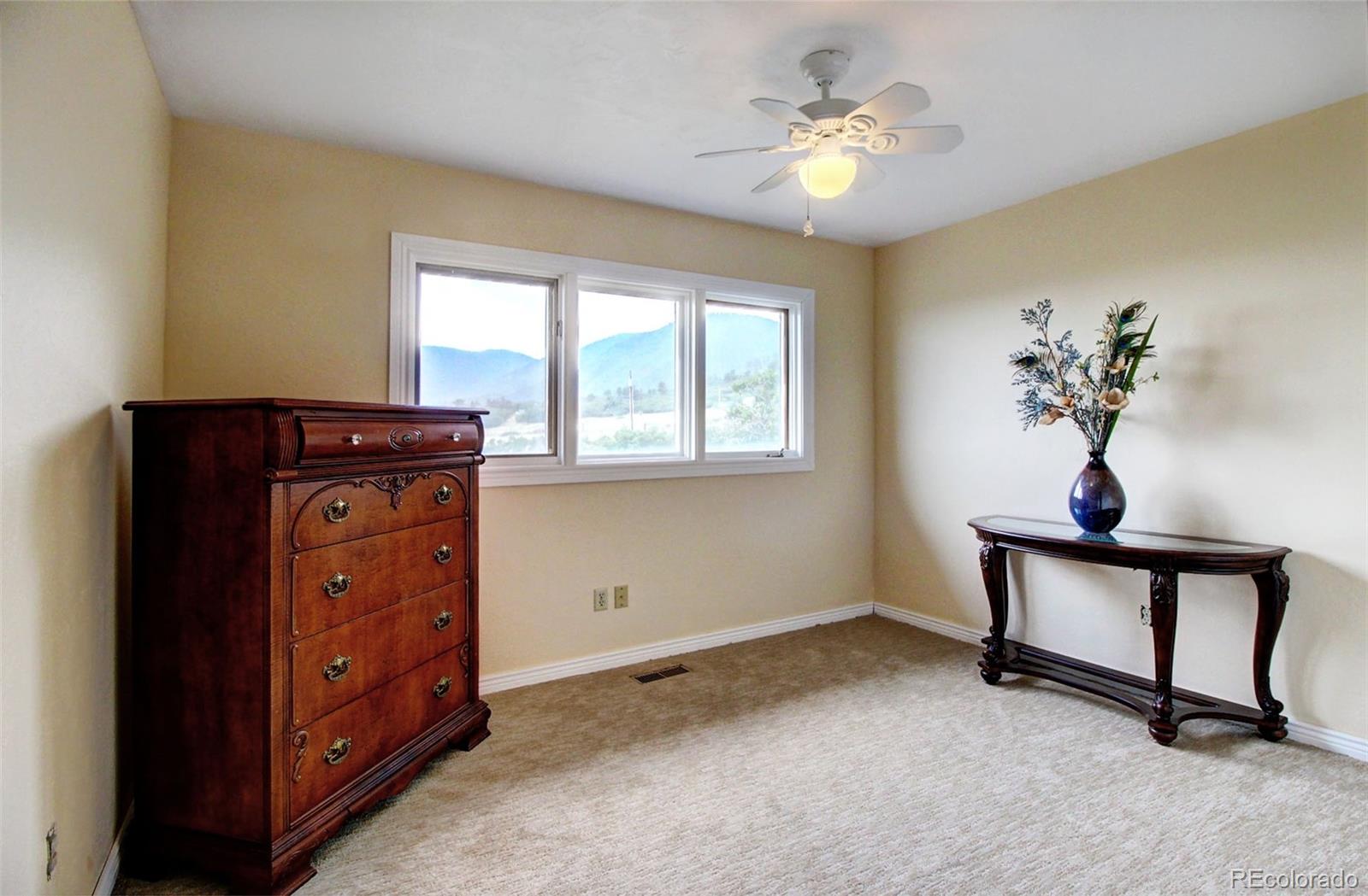 4345 Evans Road Monument, CO 80132 - Photo 2 of 40 a living room with furniture and a window