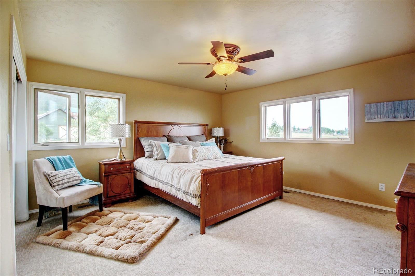 4345 Evans Road Monument, CO 80132 - Photo 24 of 40 a bedroom with a bed and window