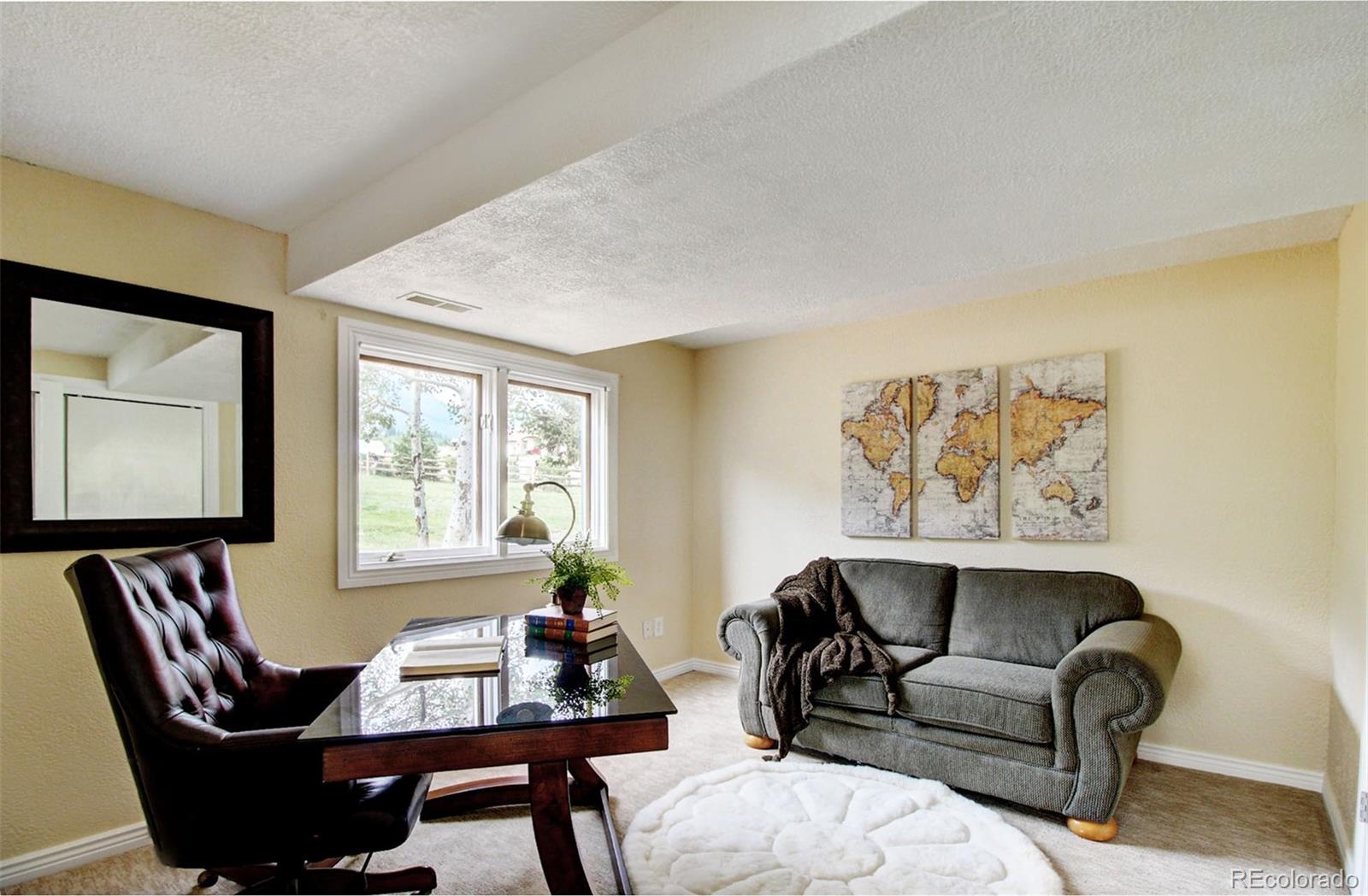 4345 Evans Road Monument, CO 80132 - Photo 33 of 40 a view of a livingroom with furniture and window
