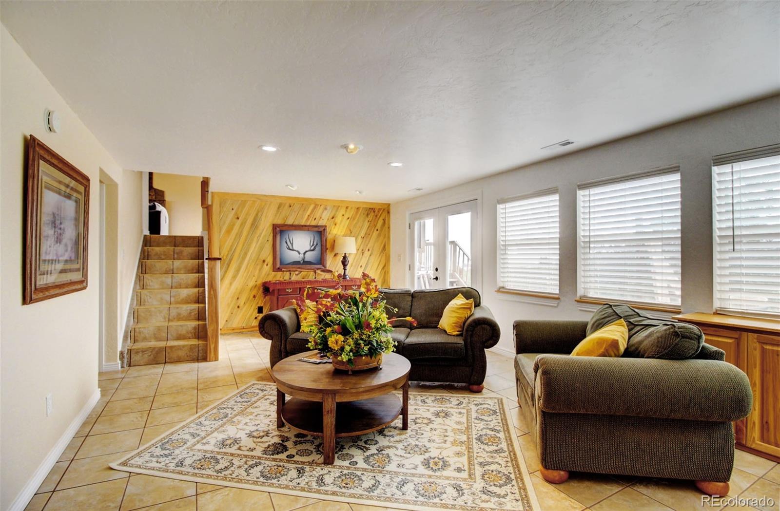 4345 Evans Road Monument, CO 80132 - Photo 35 of 40 a living room with furniture and a potted plant