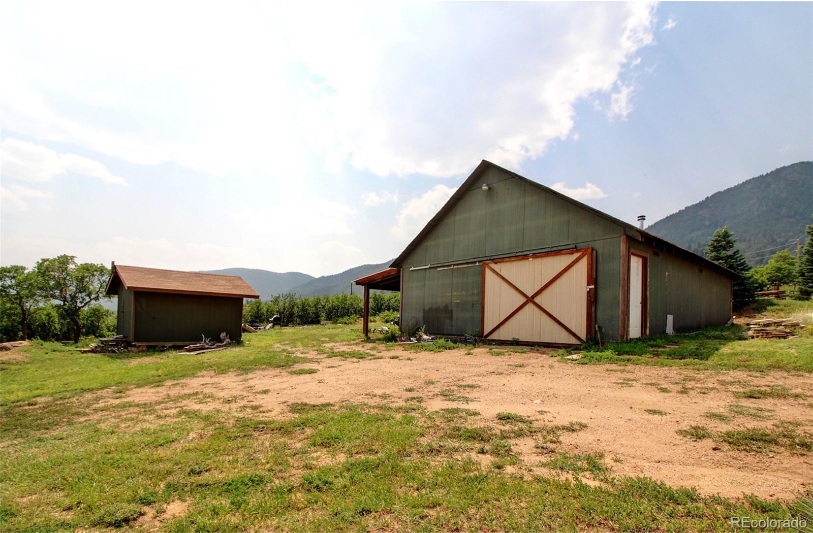4345 Evans Road Monument, CO 80132 - Photo 40 of 40 a backyard of house with wooden fence