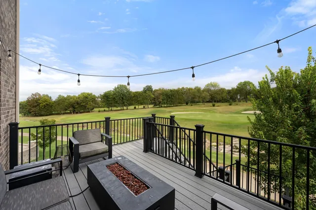 a spacious bedroom with a bed and a couch